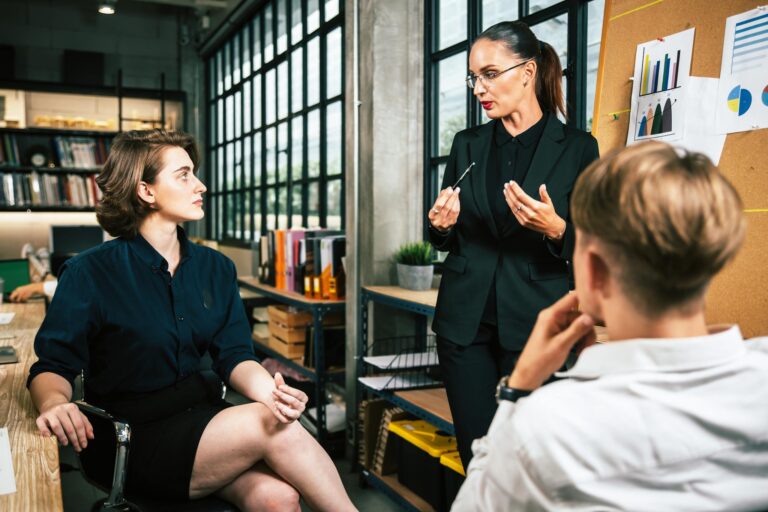 Diverse colleagues collaborative brainstorming at office briefing. Business woman manager explaining analysis at the meeting startup work.